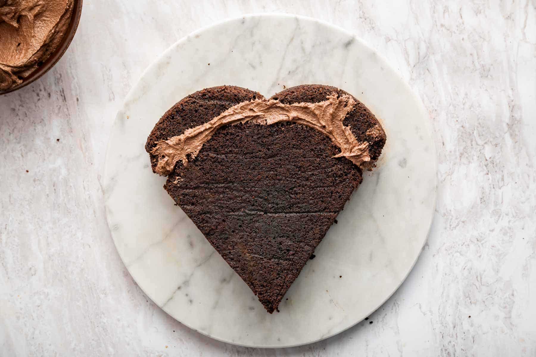 Heart shaped cake held together with frosting.