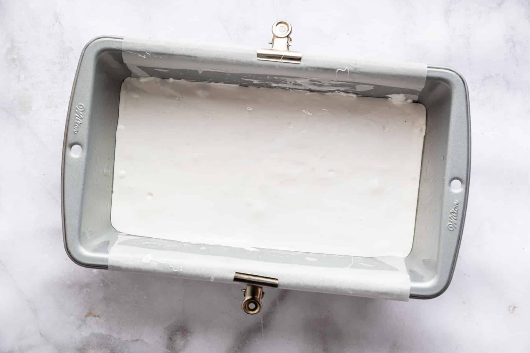 White fluff in a bread loaf pan.