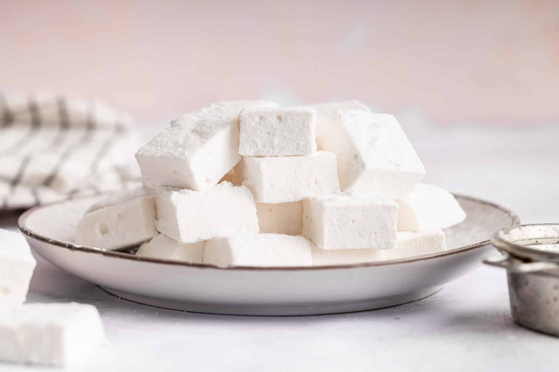 Horizontal image of homemade marshmallows on metal plate.