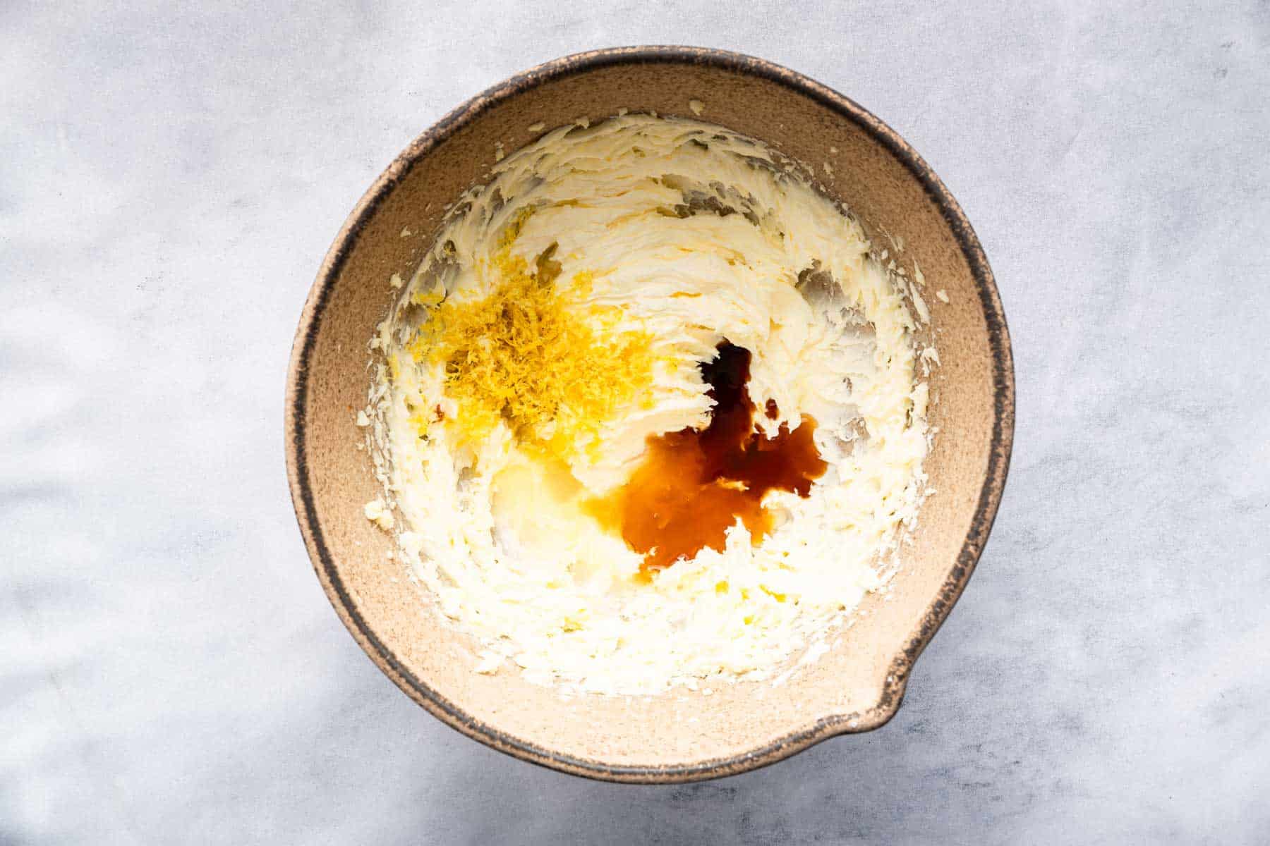 Brown brown with beaten butter, vanilla, and lemon zest on top.