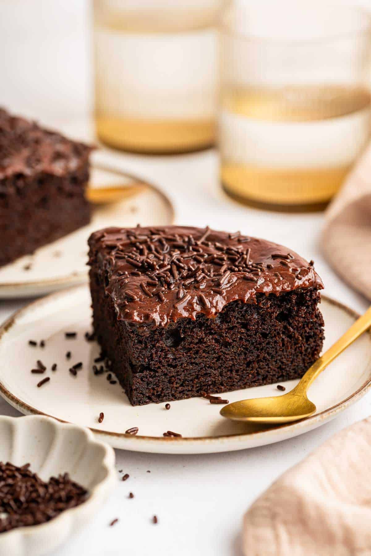 Small triangle of cake with a very thin layer of frosting.