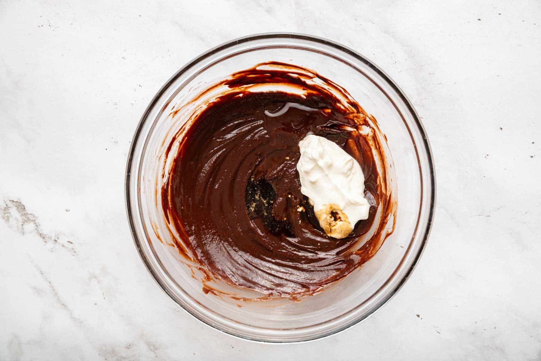 Smooth chocolate ganache with scoop of sour cream on top.