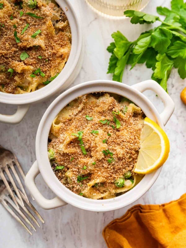 Two small casserole dishes of tuna noodle casserole no soup.